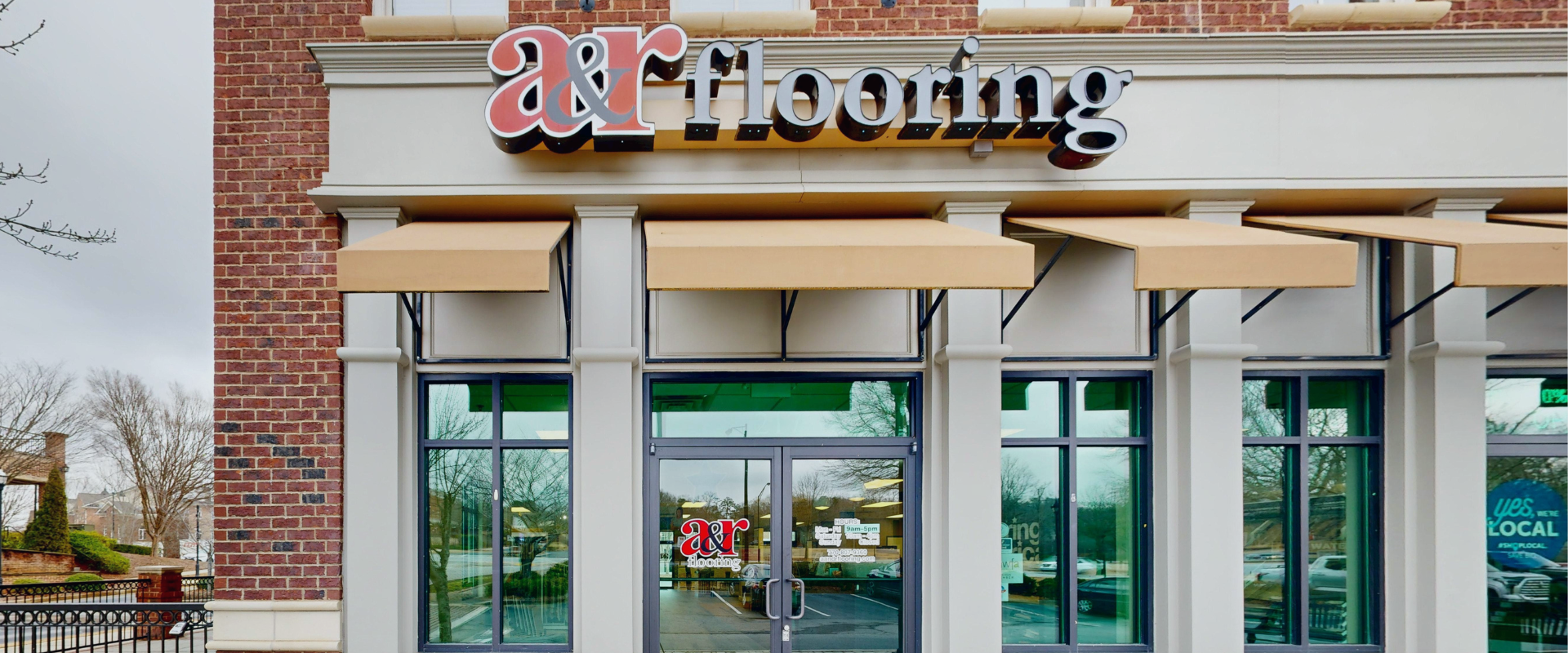Buford local flooring store exterior, front door and signage